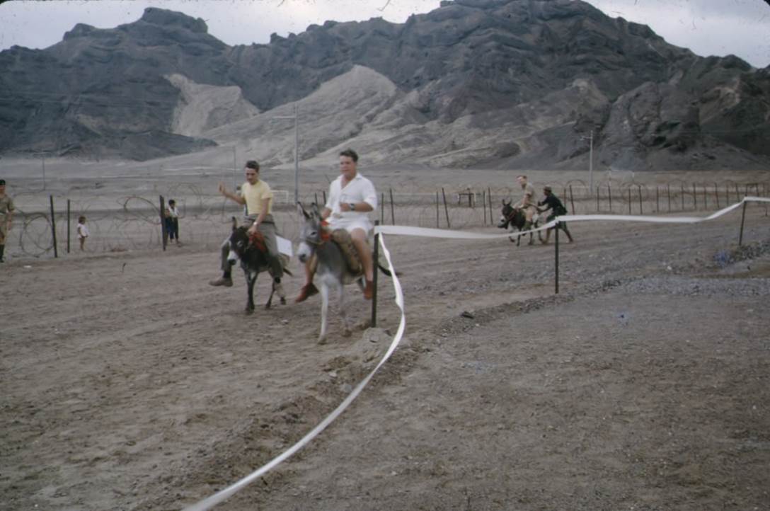 People riding horses on a dirt road
Description automatically generated with medium confidence